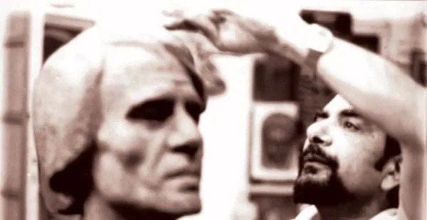 Gamal El-Sagini working on a statue of the singer Abdel Halim Hafez, about 1970