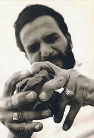Gamal El-Sagini (جمال السجيني), one of Egypt’s most prominent 20th-century sculptors and figures of Egyptian Social Realism, shaping a piece of clay, with rings prominent on both hands